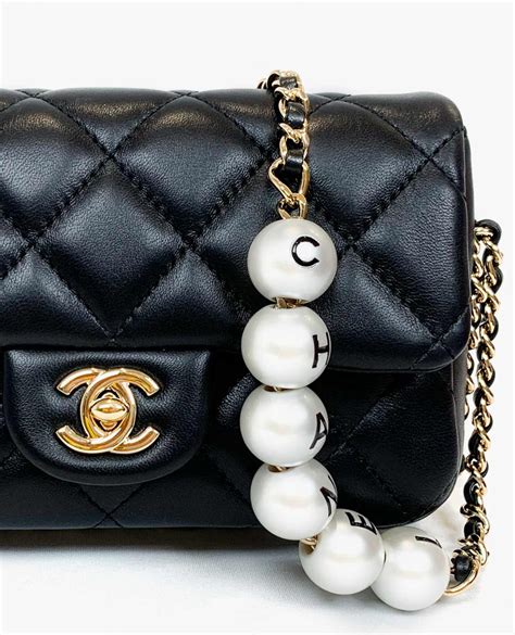 chanel bag with pearls strap.